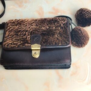 Patricia Nash shearling and leather crossbody bag with pom poms 9"x 7"x 2.5"